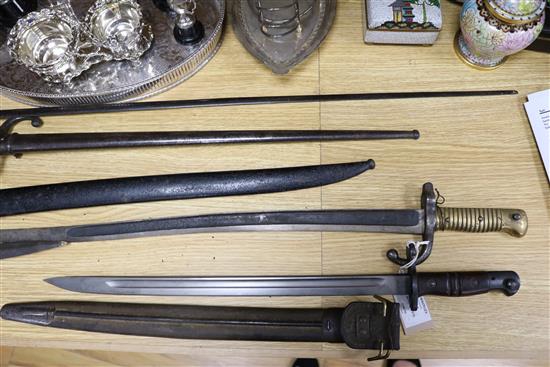 Three late 19th century French bayonets, a US Army bayonet, an EFD 1892 bayonet and an epee